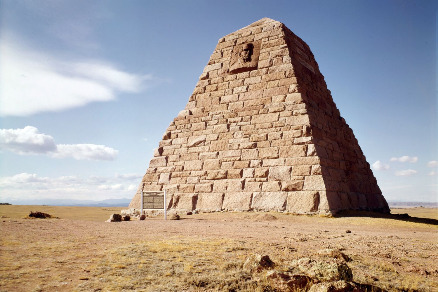 The granite pyramid of the Ames Monument alone on the high plain.